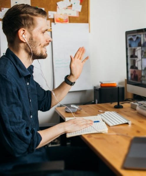 person on computer doing a Skype interview for a Job