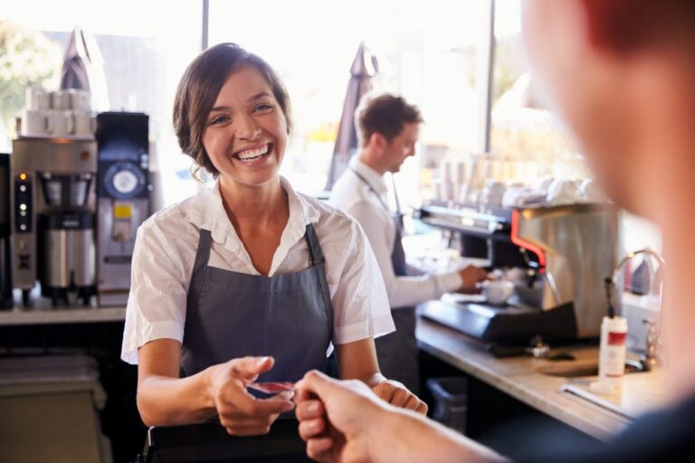 Female-Shop-Assistant taking payment on card