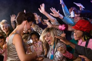 Celebrity signing autographs