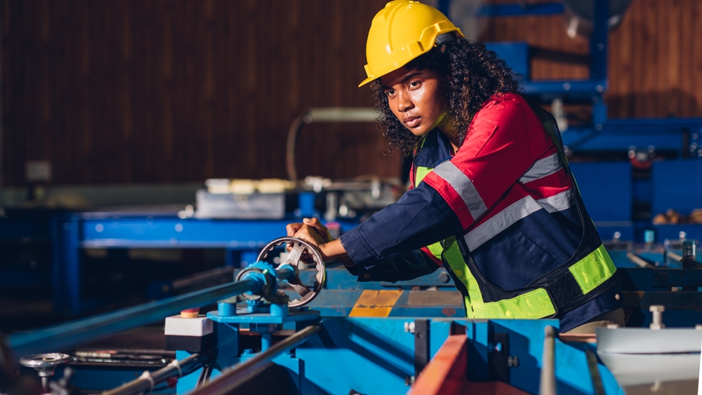 Women at work bench in manufacturing plant