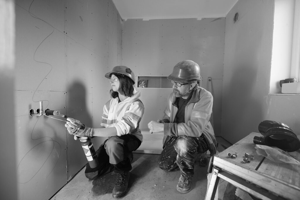 Women working with male manager in room